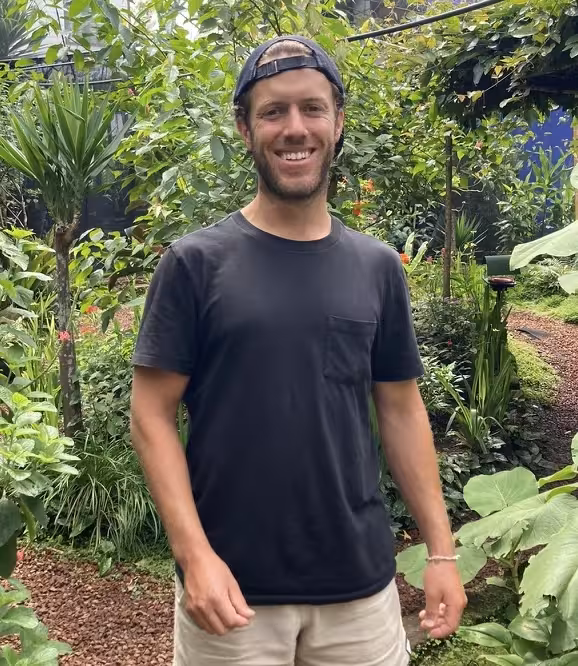 Robin Shindelman with his back to the jungle.
